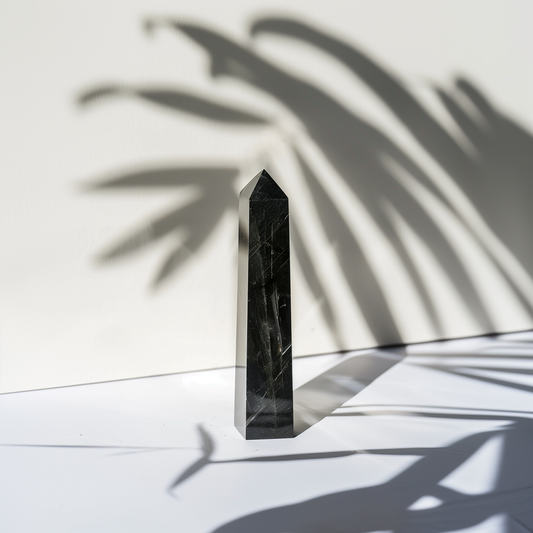 "A 4.9-inch Black Tourmaline Tower, symbolizing protection and grounding energy, elegantly displayed in a serene space, ideal for meditation and intention setting."